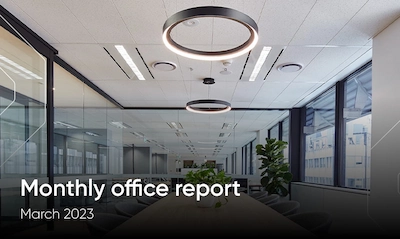 Cover slide for a monthly office report dated March 2023 featuring an interior view of a modern office space with circular overhead lighting.